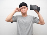 asian man holding a virtual reality headset